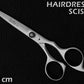 hair scissors on leather black background